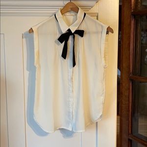 White sleeveless blouse with black ribbon tie